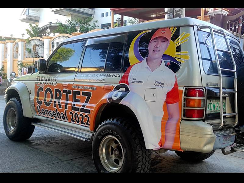 SUV wrapped in a printed vinyl sticker ad